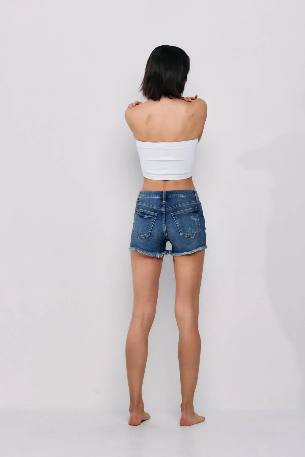 Mid Rise Frayed Short In Medium Wash